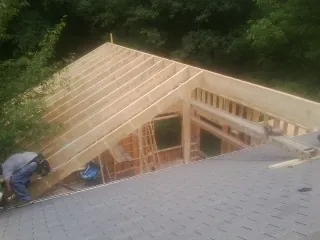 Framing a new roof addition that ties into an existing shingle roof in Sallisaw